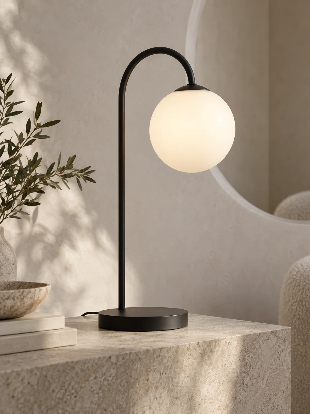 Halo globe lamp against a pale architectural wall
