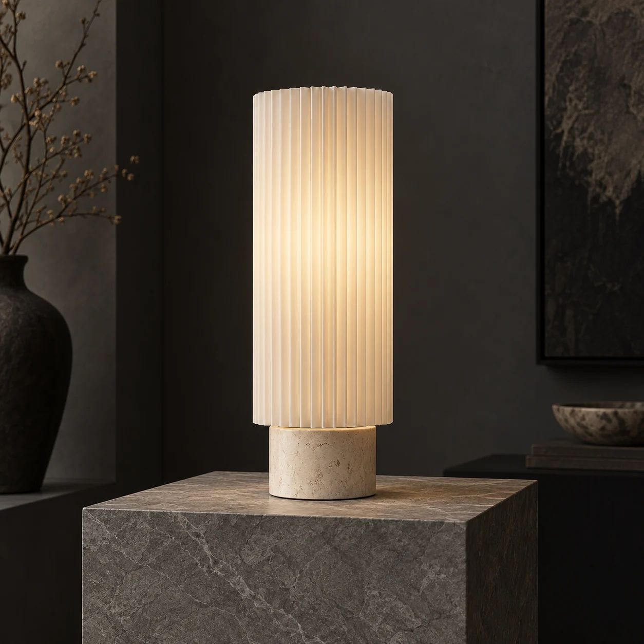 Tall cream ribbed lamp on a stone pedestal